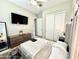 Spacious bedroom features modern decor, including a ceiling fan, large windows, and closet space at 8024 W State Ave, Glendale, AZ 85303
