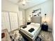 Cozy bedroom with a decorative rug, upholstered bedframe, closet and modern lighting at 8024 W State Ave, Glendale, AZ 85303