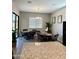 Cozy breakfast nook with tile floors, wicker furniture and bright lighting at 8024 W State Ave, Glendale, AZ 85303