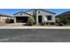 Charming single-story home with a well-manicured front yard and a two-car garage at 8024 W State Ave, Glendale, AZ 85303