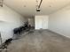 Spacious garage featuring epoxy flooring at 8024 W State Ave, Glendale, AZ 85303
