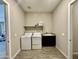 Well-equipped laundry room with modern appliances and ample counter space at 8024 W State Ave, Glendale, AZ 85303