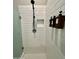 Modern shower with white subway tile, recessed shelf and mounted soap and shampoo dispensers at 8024 W State Ave, Glendale, AZ 85303