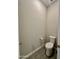 Efficient toilet room with wood-look tile flooring and updated fixtures at 8024 W State Ave, Glendale, AZ 85303