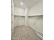 Spacious walk-in closet with ample storage and neutral flooring at 8024 W State Ave, Glendale, AZ 85303