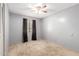 Bedroom featuring neutral carpet and closet with dark curtains at 9227 N 36Th Dr, Phoenix, AZ 85051