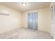 Bright bedroom features neutral carpet and walls, and closet for ample storage at 9227 N 36Th Dr, Phoenix, AZ 85051