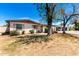 Front exterior view of a single-story home with a carport and minimal desert landscaping at 9227 N 36Th Dr, Phoenix, AZ 85051