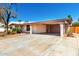 Exterior view featuring a carport and desert landscaping at 9227 N 36Th Dr, Phoenix, AZ 85051