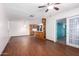 Open living area with laminate floors and an open layout to kitchen and sliding door at 9227 N 36Th Dr, Phoenix, AZ 85051