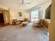 Bright living room with comfortable furniture, a ceiling fan, and lots of natural light at 9406 S 47Th Pl, Phoenix, AZ 85044