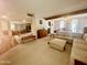 Bright and airy living room with open layout flowing into other living spaces at 9406 S 47Th Pl, Phoenix, AZ 85044