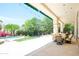 Expansive backyard featuring pool, manicured lawn, and covered patio at 10800 E Cactus Rd # 34, Scottsdale, AZ 85259