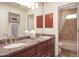 Bathroom featuring dual sinks, a vanity with a granite countertop and a shower at 10800 E Cactus Rd # 34, Scottsdale, AZ 85259