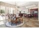 Open dining area with patio access, wood floors, and easy access to the kitchen at 10800 E Cactus Rd # 34, Scottsdale, AZ 85259