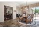 Open dining area with patio access, seamlessly integrated with the adjacent living area and kitchen at 10800 E Cactus Rd # 34, Scottsdale, AZ 85259