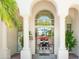 Grand entrance with arched doorways offer a captivating view of the dining room and beyond at 10800 E Cactus Rd # 34, Scottsdale, AZ 85259