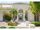 Arched doorway reveals a glimpse of the dining area, adding charm to the front entrance at 10800 E Cactus Rd # 34, Scottsdale, AZ 85259