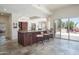 Open kitchen with granite countertops, breakfast bar, and access to the outdoor living space at 10800 E Cactus Rd # 34, Scottsdale, AZ 85259
