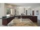 Spacious kitchen with granite counters, stainless appliances, and island cooktop at 10800 E Cactus Rd # 34, Scottsdale, AZ 85259