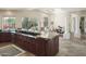 Open kitchen with granite counters, stainless appliances, and island cooktop overlooking dining area at 10800 E Cactus Rd # 34, Scottsdale, AZ 85259