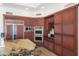 Spacious kitchen with granite counters, stainless steel appliances and wood cabinetry at 10800 E Cactus Rd # 34, Scottsdale, AZ 85259