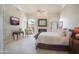 Main bedroom featuring a fireplace, access to the outside, and neutral decor at 10800 E Cactus Rd # 34, Scottsdale, AZ 85259