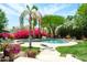 Relaxing backyard pool with mature landscaping, perfect for outdoor enjoyment at 10800 E Cactus Rd # 34, Scottsdale, AZ 85259