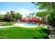 Private backyard pool surrounded by mature trees, lush landscaping, and a serene atmosphere at 10800 E Cactus Rd # 34, Scottsdale, AZ 85259