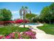 Backyard pool surrounded by lush, flowering plants, perfect for relaxation and outdoor entertainment at 10800 E Cactus Rd # 34, Scottsdale, AZ 85259