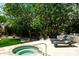 Inviting in-ground spa featuring plenty of trees for shade and chaise lounges for relaxing at 10800 E Cactus Rd # 34, Scottsdale, AZ 85259