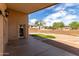 Enjoy outdoor living with a putting green, covered patio, and well-maintained landscaping in the backyard at 12428 W Vermont Ct, Litchfield Park, AZ 85340