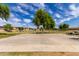 Enjoy the community basketball court and playground surrounded by mature trees and open space at 12428 W Vermont Ct, Litchfield Park, AZ 85340