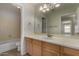 Bathroom with a spacious vanity and mirror at 12428 W Vermont Ct, Litchfield Park, AZ 85340
