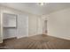 Neutral bedroom featuring a spacious closet and carpet floors at 12428 W Vermont Ct, Litchfield Park, AZ 85340
