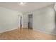 Bright bedroom featuring hardwood floors and a closet at 12428 W Vermont Ct, Litchfield Park, AZ 85340