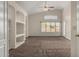 The main bedroom features neutral walls and carpet flooring at 12428 W Vermont Ct, Litchfield Park, AZ 85340