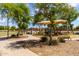 Community playground featuring ample play equipment, shade structures, and seating perfect for Gathering fun at 12428 W Vermont Ct, Litchfield Park, AZ 85340