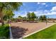 Active community park with a volleyball court, playground and picnic facilities, perfect for outdoor activities and gatherings at 12428 W Vermont Ct, Litchfield Park, AZ 85340