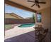 Covered patio overlooking a pool, and backyard at 12503 W Vista Paseo Dr, Litchfield Park, AZ 85340