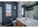 Bathroom features a sink, vanity, and mirror at 12503 W Vista Paseo Dr, Litchfield Park, AZ 85340