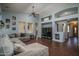Spacious living room features hardwood floors, a ceiling fan, and plenty of natural light at 12503 W Vista Paseo Dr, Litchfield Park, AZ 85340