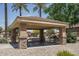 Community picnic area features a sheltered seating area with tables and barbecue at 12503 W Vista Paseo Dr, Litchfield Park, AZ 85340