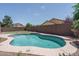 Sparkling pool with artificial turf and mature trees at 12503 W Vista Paseo Dr, Litchfield Park, AZ 85340