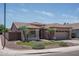 Charming home on a corner lot with a well-manicured lawn and mature palm trees at 12503 W Vista Paseo Dr, Litchfield Park, AZ 85340