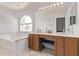 Bathroom with tub, double sink vanity, and large mirror at 13270 N 93Rd Way, Scottsdale, AZ 85260