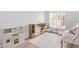 Playful bedroom with furniture, a cute play kitchen, a TV and a large rug on wood floors at 13270 N 93Rd Way, Scottsdale, AZ 85260