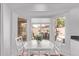 Breakfast nook features a charming table, chairs, and a window overlooking the backyard pool at 13270 N 93Rd Way, Scottsdale, AZ 85260