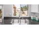 Kitchen sink with backyard views of a pool at 13270 N 93Rd Way, Scottsdale, AZ 85260