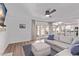 Cozy living room features a comfy sectional sofa, ceiling fan, and access to outdoor patio at 13270 N 93Rd Way, Scottsdale, AZ 85260